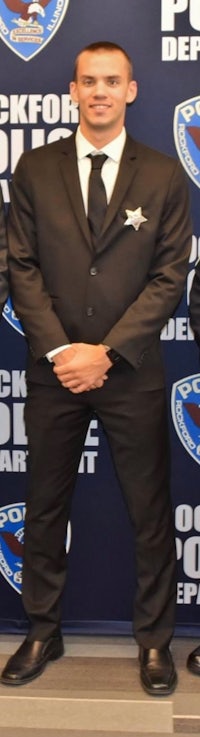 two men in suits standing next to each other