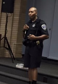 a police officer standing in front of a podium