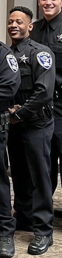 a group of police officers posing for a photo